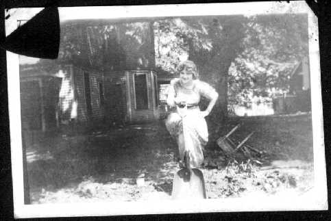 Here is a girl standing behind our house.  We scanned this image from the photo album of an elderly lady who lived in the house behind us for many years.